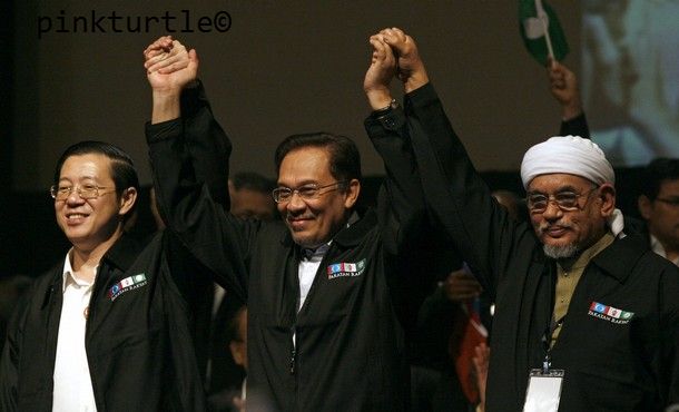 Malaysia's opposition leaders hold hands at the end of their People's Alliance conference in Shah Alam